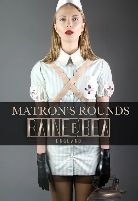 Client wearing nurse-style white cap and shirt with black cross straps in commercial fashion portrait
