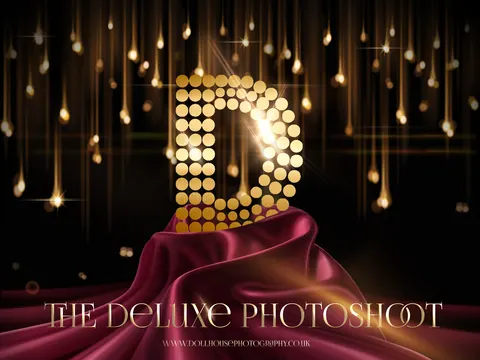 Promotional image for luxury photoshoot package: large glittering D logo with burgundy fabric drape