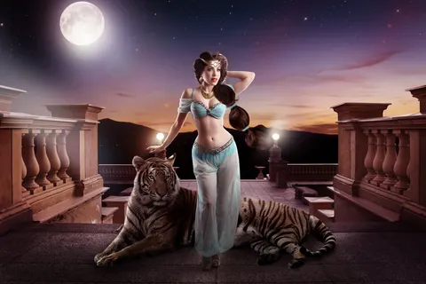 Client in aqua corset crop top in temple ruins setting with dramatic evening lighting
