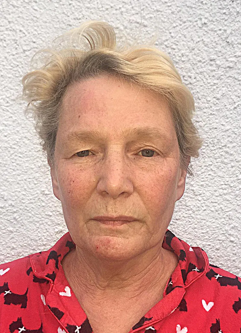 Jane in casual selfie wearing red heart-patterned shirt, everyday appearance
